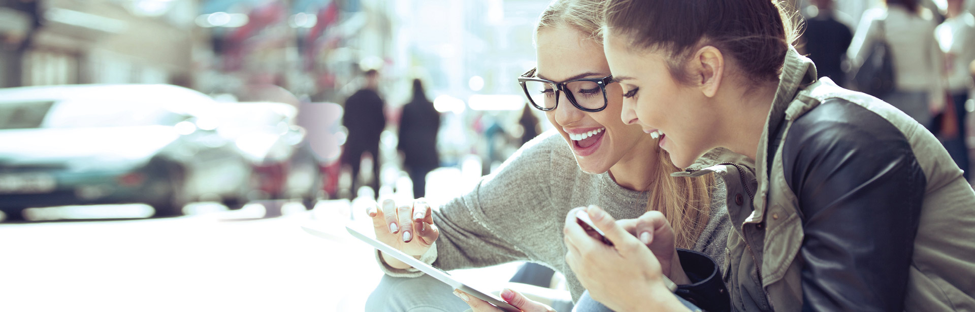 Two girls banking online