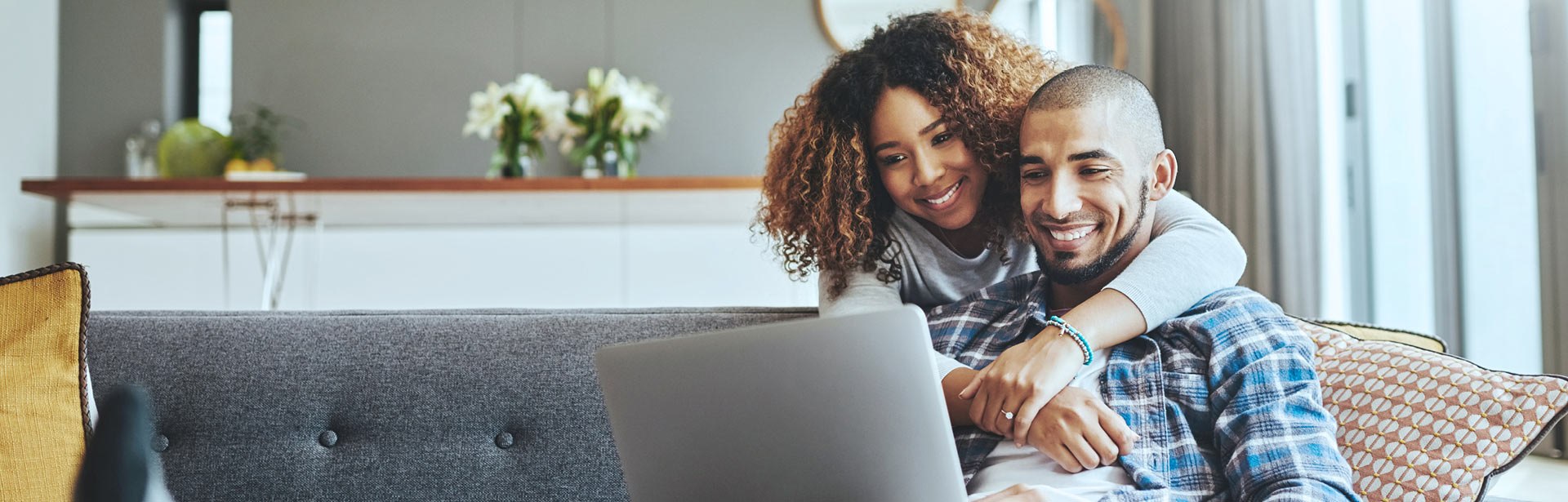 couple at home checking their loan status