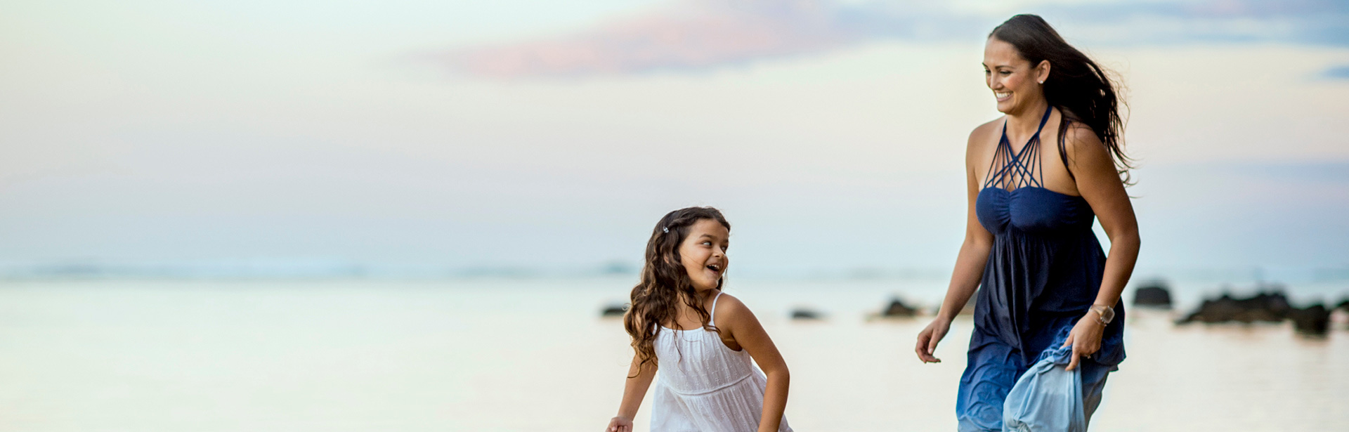 Mother and daughter on the beach