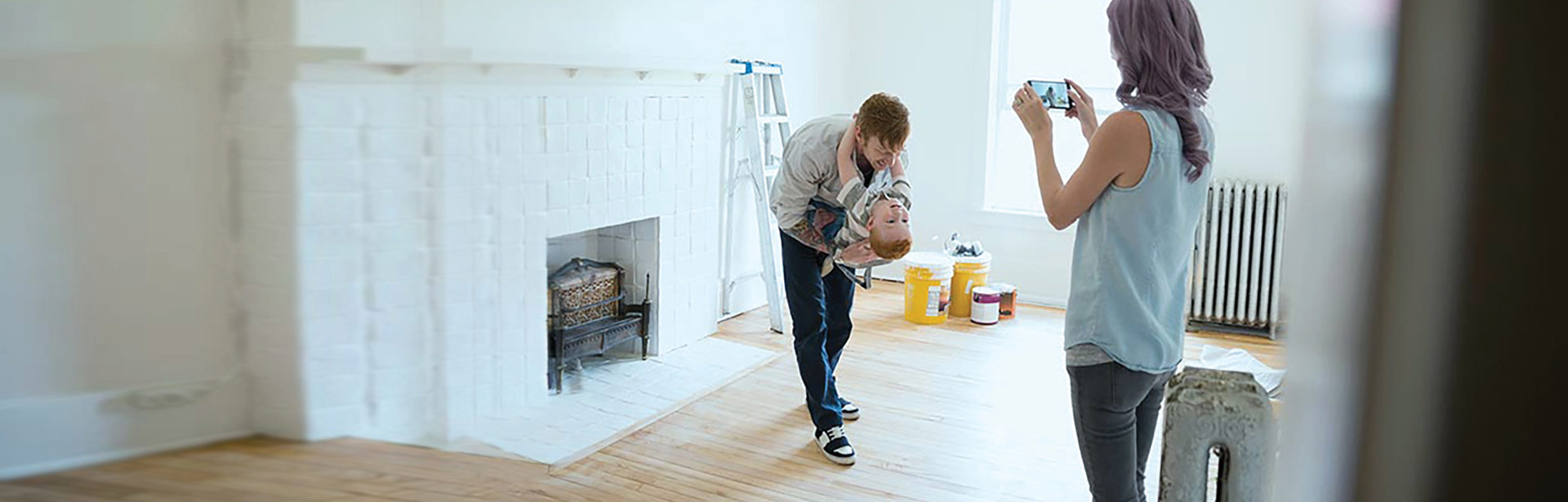 Happy couple with their child in a new home